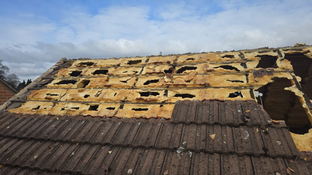 This is a spray foam removal job in progress on a residential property in Surrey.