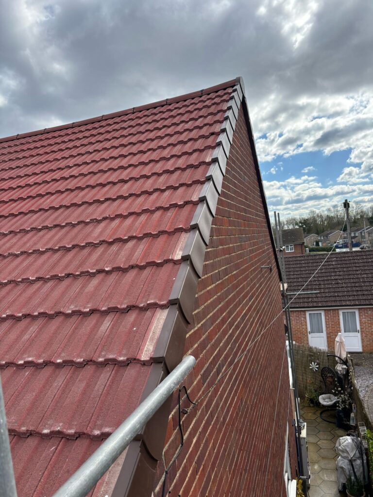 This photo shows a roof in Surrey before spray foam removal started.