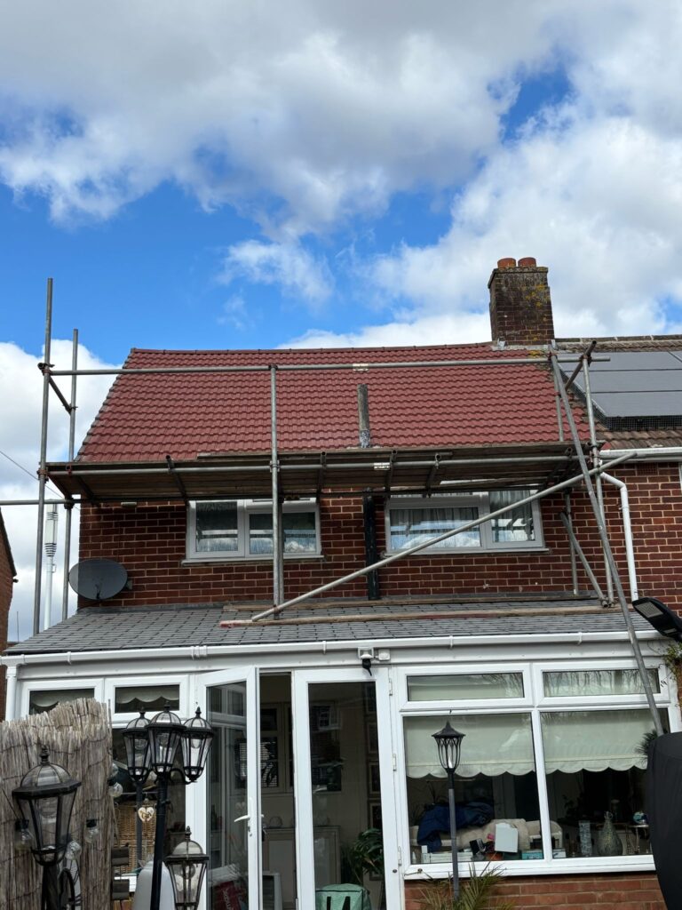This photo shows a roof in Surrey before spray foam removal started.