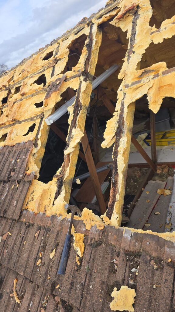 This is a spray foam removal job in progress on a residential property in Surrey.